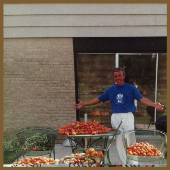 My dad amidst his bountiful tomatoes. 