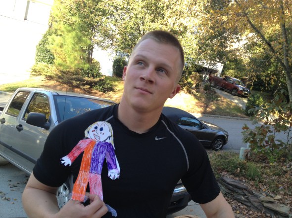 Taking a moment to pause, Flat Stanleyette enjoys being around this strapping young Soldier!